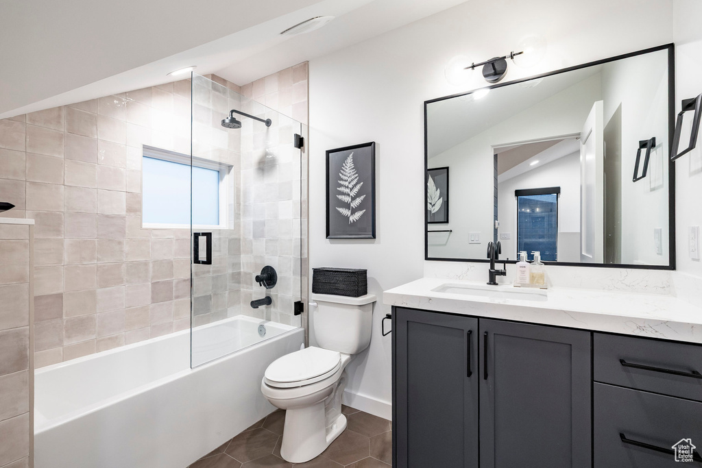 Full bath featuring vanity, tile patterned flooring, and bathtub / shower combination