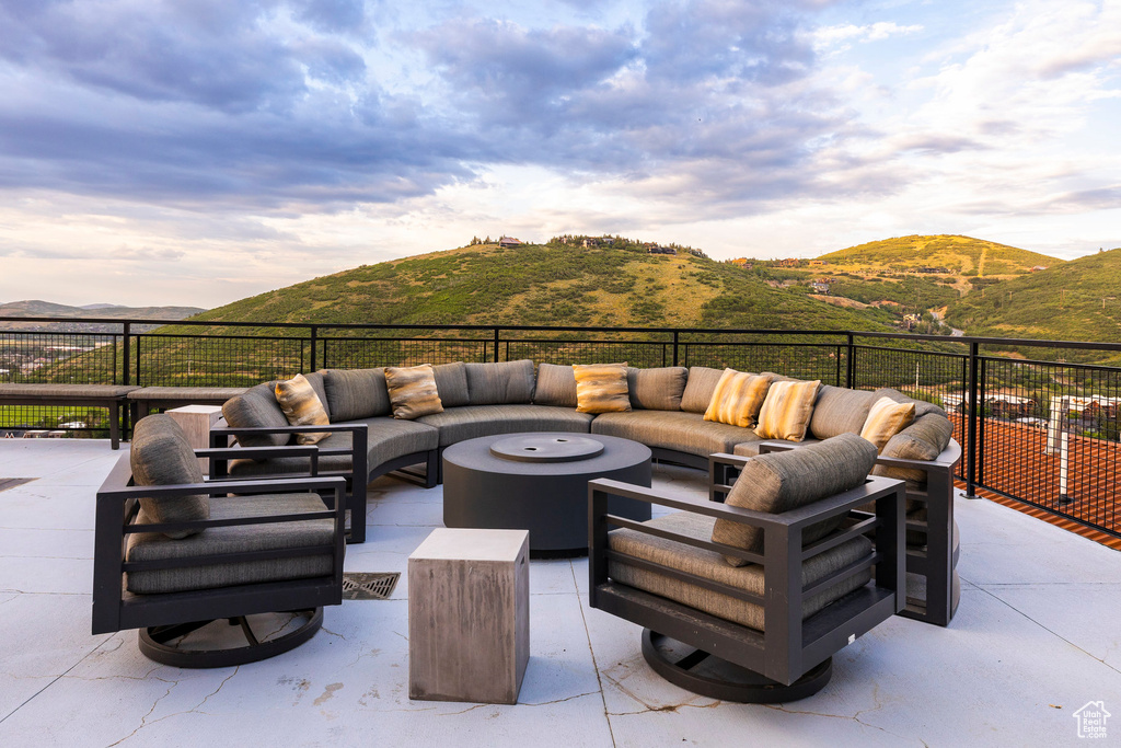 View of patio / terrace featuring an outdoor hangout area and a mountain view