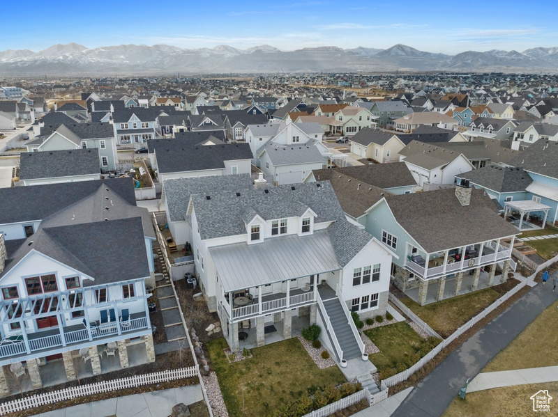 Aerial perspective of suburban area with a mountainous background
