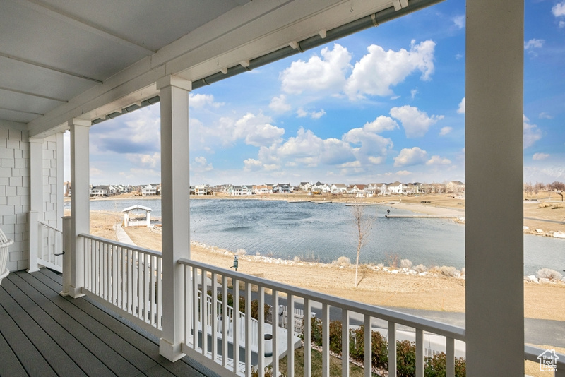 Wooden deck featuring a water view