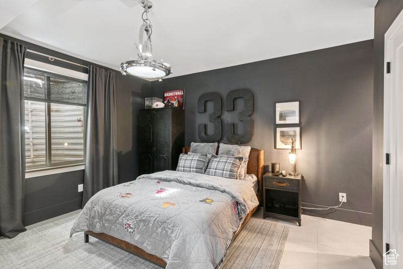 Bedroom with tile patterned floors