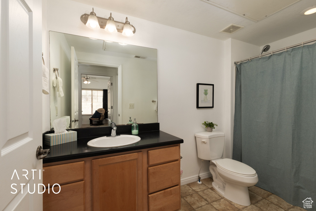 Full bathroom featuring vanity and toilet