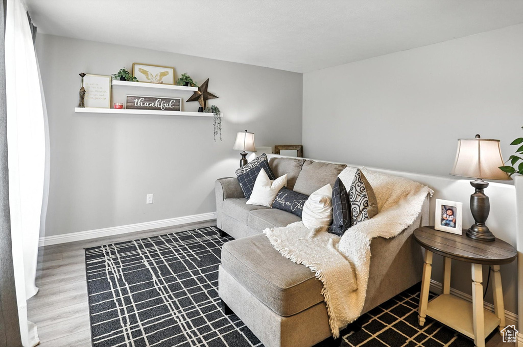 Living area featuring wood finished floors and baseboards