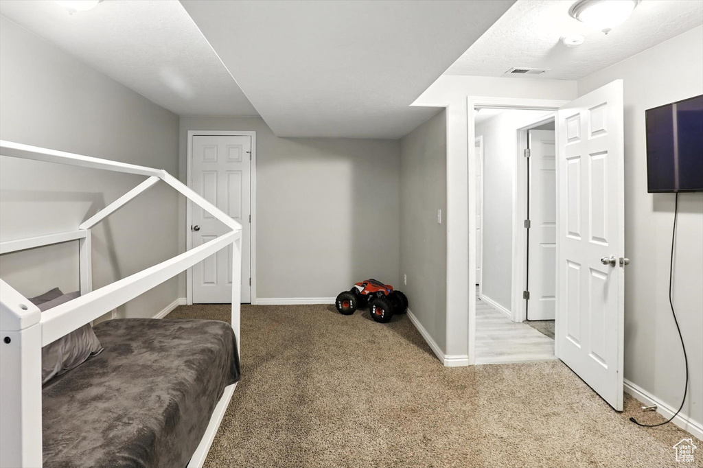 Bedroom with carpet and baseboards