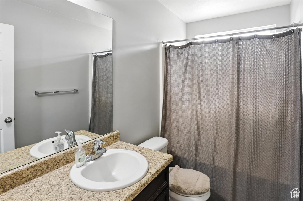 Bathroom with vanity and a shower with curtain