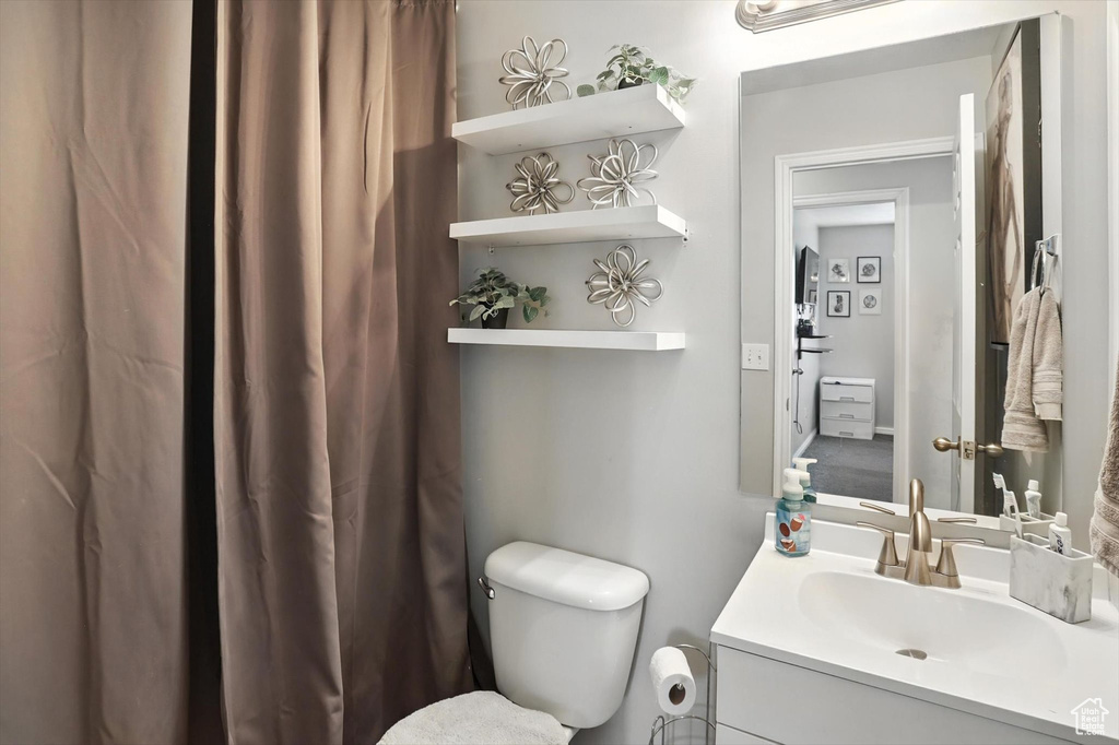 Bathroom featuring toilet and vanity