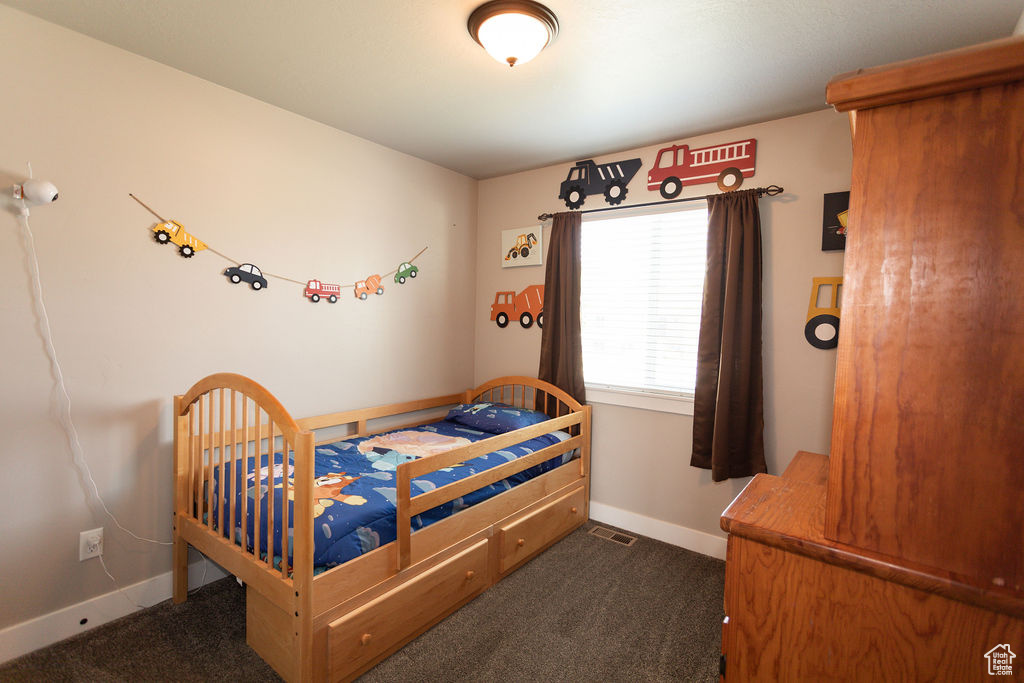 Carpeted bedroom with baseboards