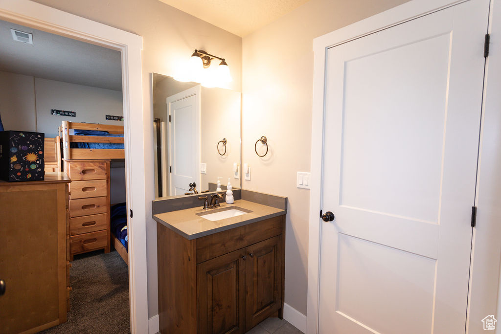 Bathroom with vanity and baseboards