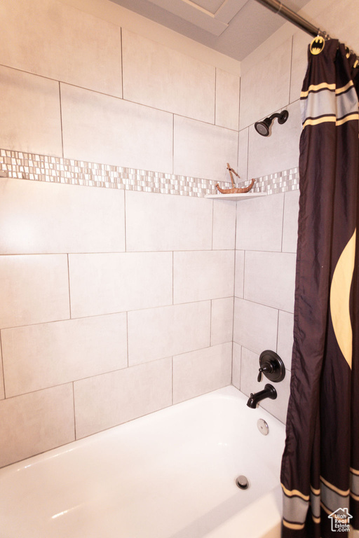 Bathroom featuring shower / tub combo
