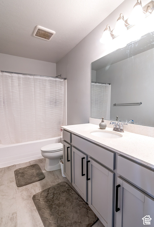 Full bathroom with vanity and shower / bathtub combination with curtain