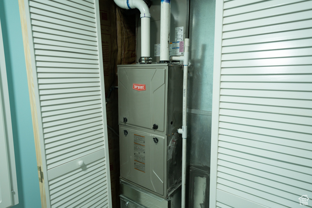 Utility room featuring heating unit