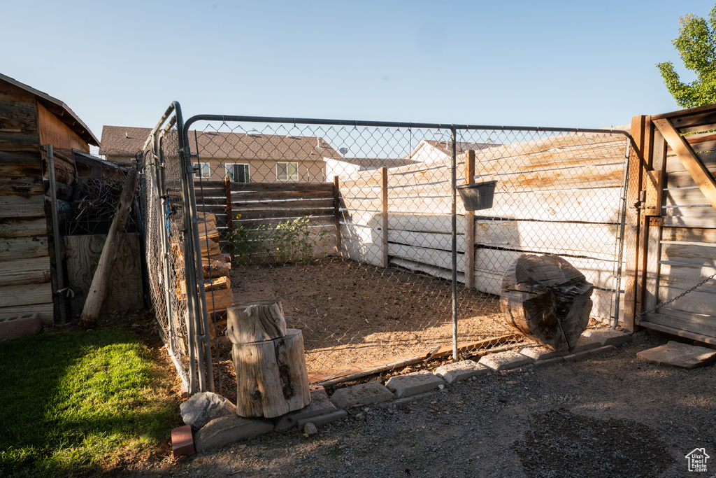 View of yard featuring a gate
