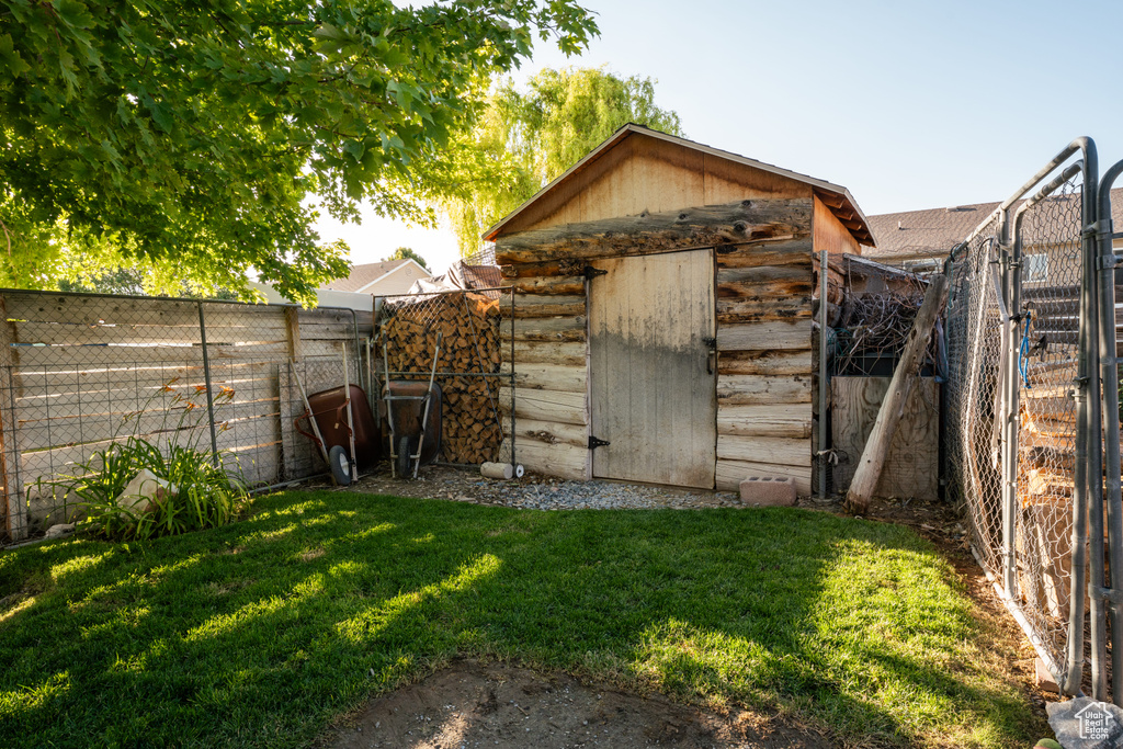 View of shed featuring a fenced backyard