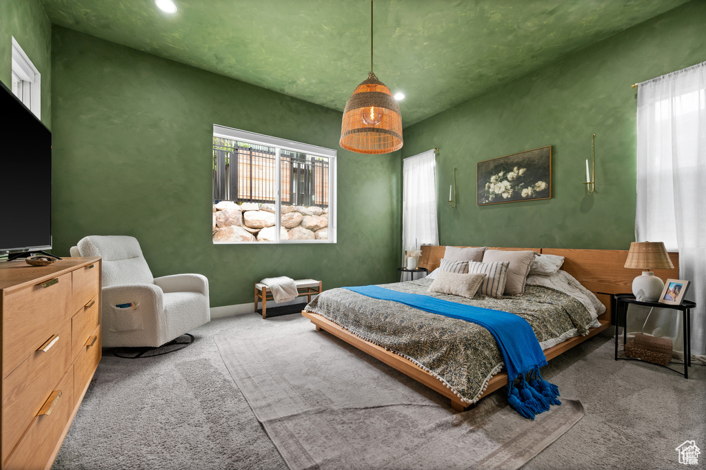 Bedroom featuring carpet, multiple windows, and recessed lighting
