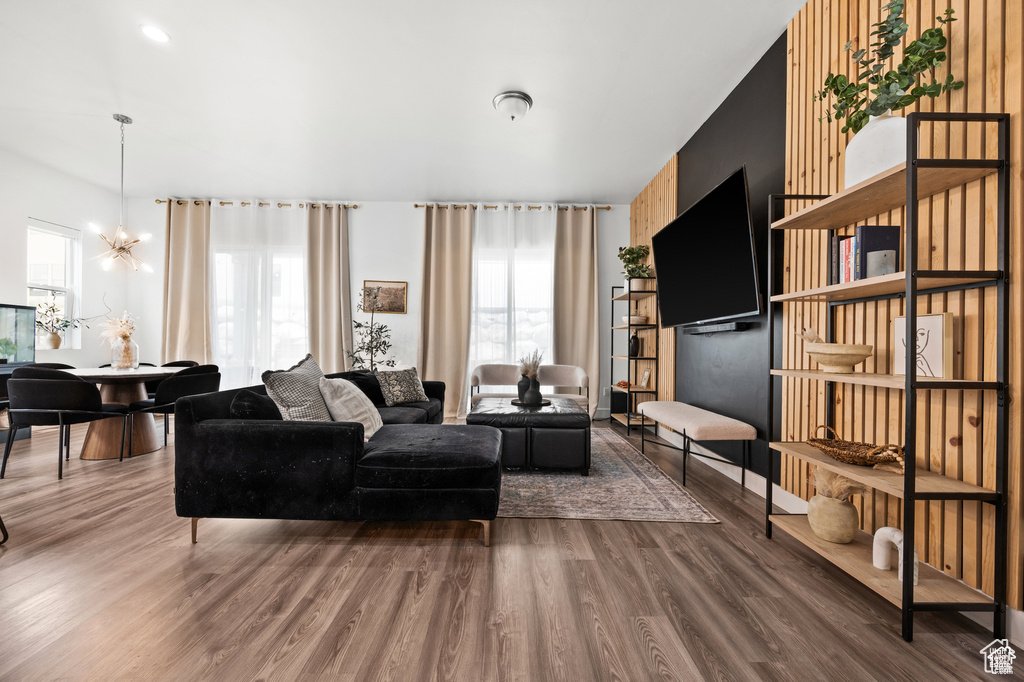 Living room with a chandelier and wood finished floors