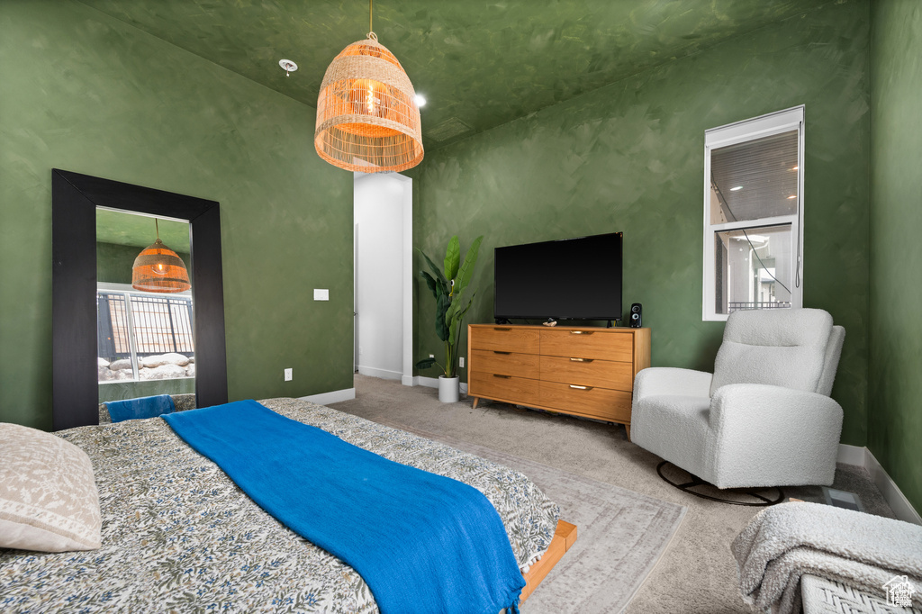 Bedroom with carpet floors and baseboards