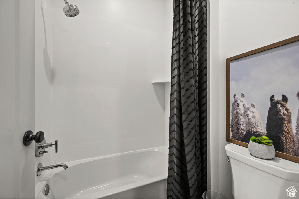 Full bath with shower / bath combo and toilet