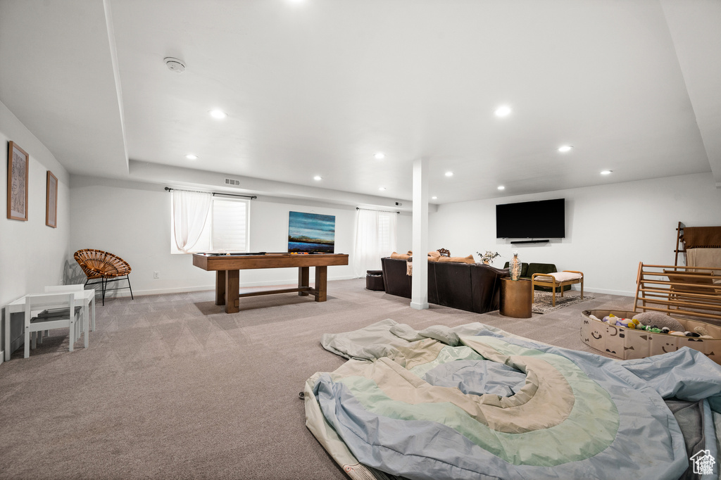 Living room with recessed lighting, light colored carpet, and pool table