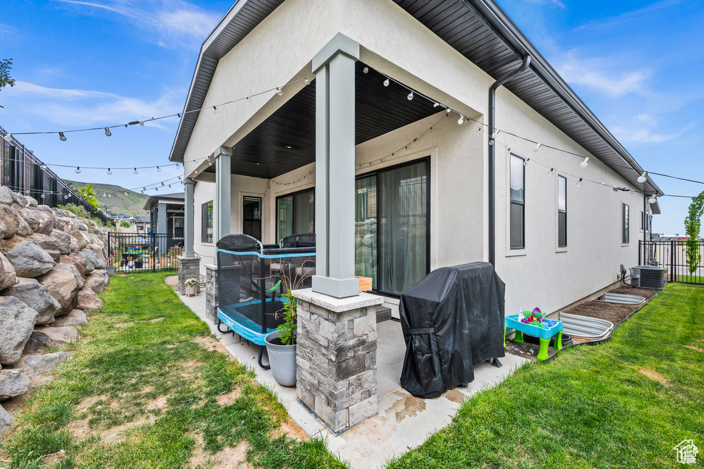 Back of house featuring stucco siding