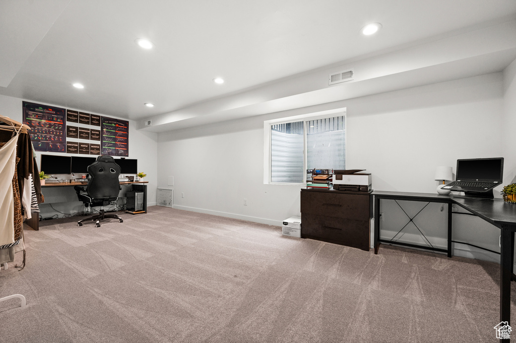 Office space featuring carpet floors and recessed lighting