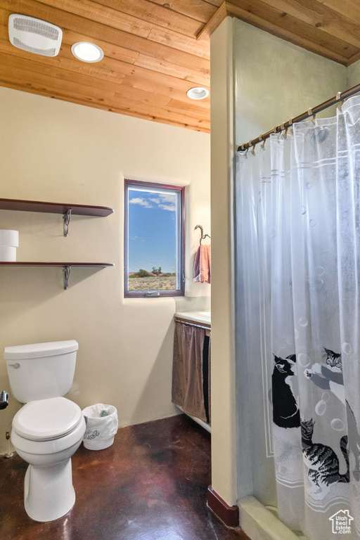 Bathroom with concrete floors, wooden ceiling, curtained shower, and recessed lighting