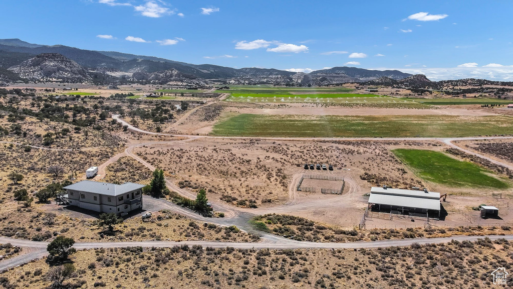 Aerial view of sparsely populated area with a mountainous background