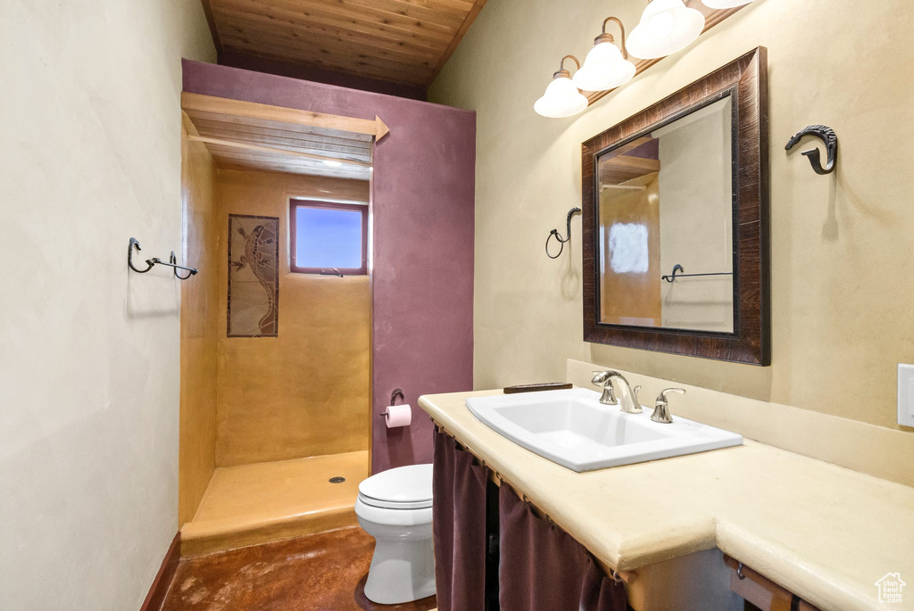 Bathroom with vanity, wooden ceiling, and a shower