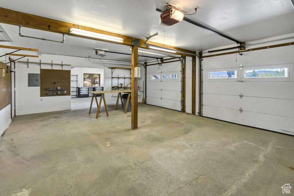 Garage with a garage door opener and electric panel