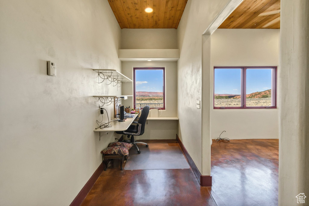 Office space with wood ceiling, finished concrete flooring, and recessed lighting