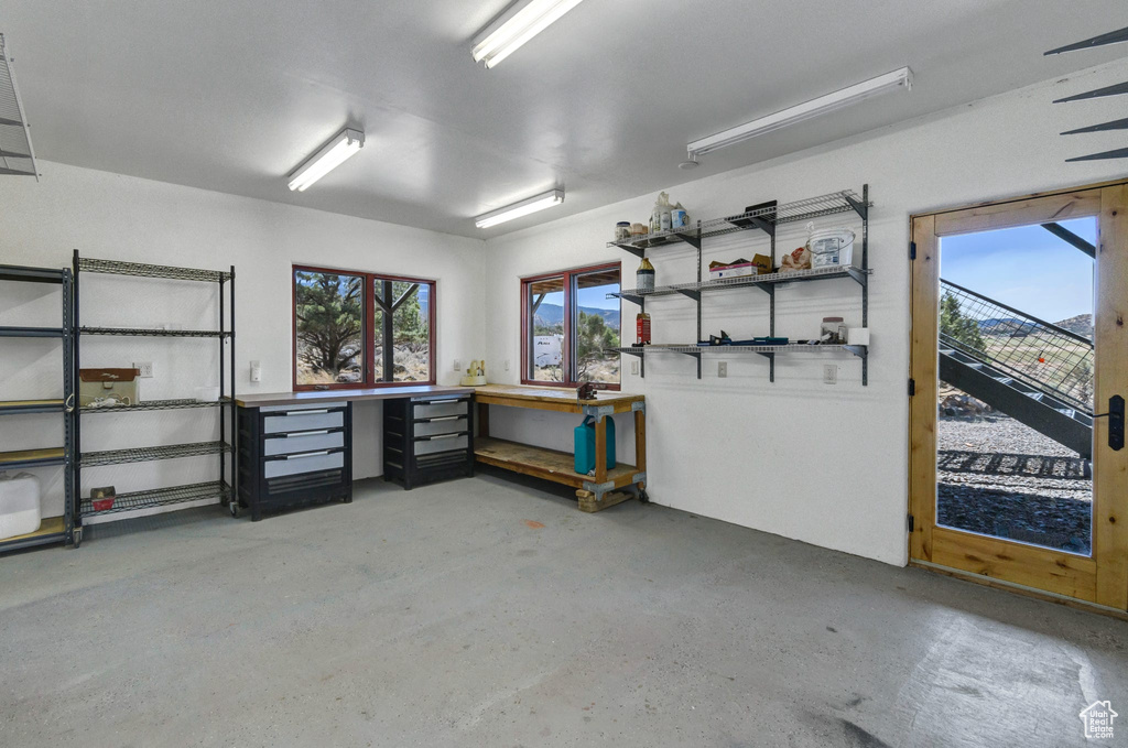 Garage featuring a workshop area