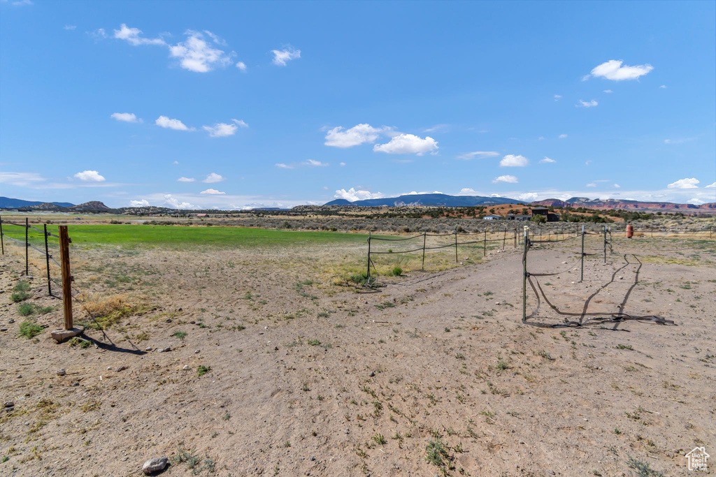 View of yard featuring a rural view and a mountain view