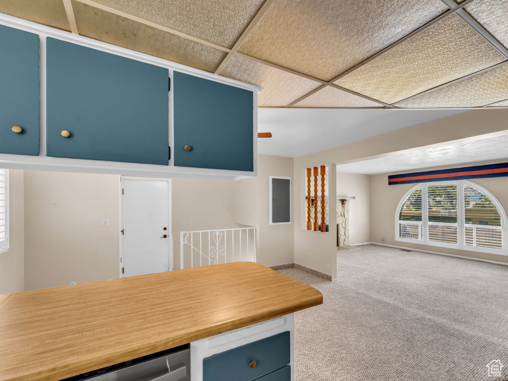 Unfurnished dining area featuring light colored carpet