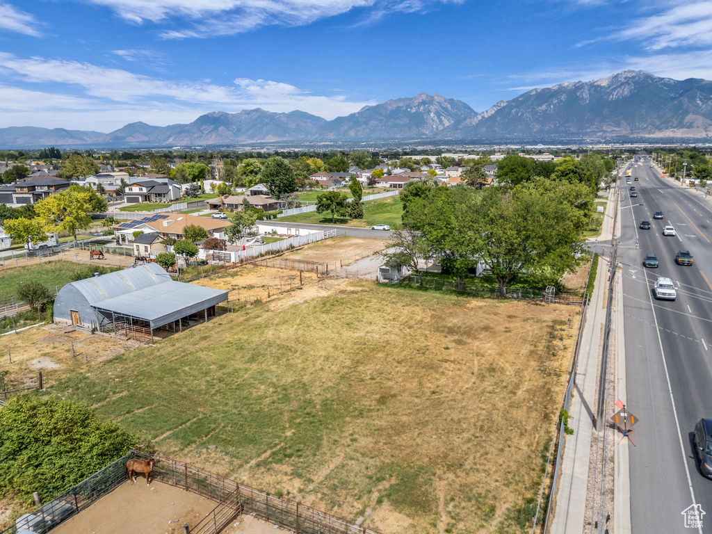 View of mountain backdrop featuring nearby suburban area