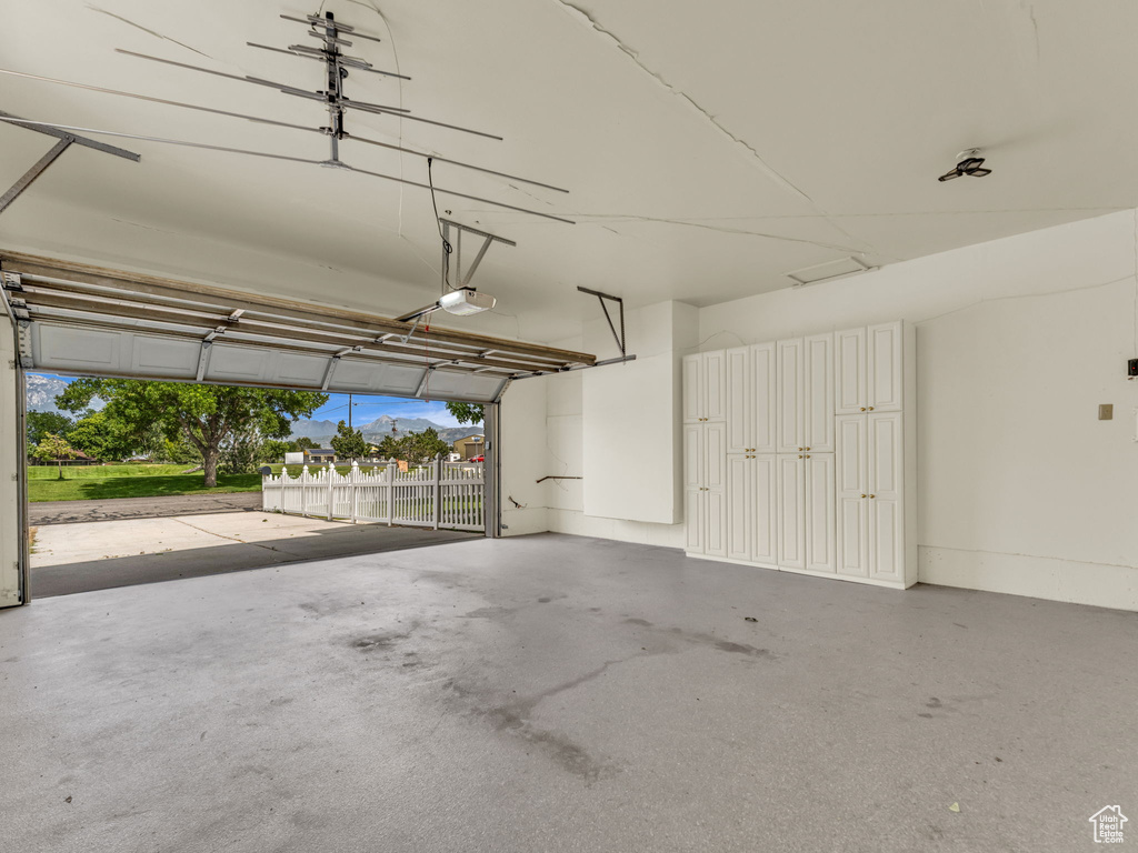 Garage featuring a garage door opener