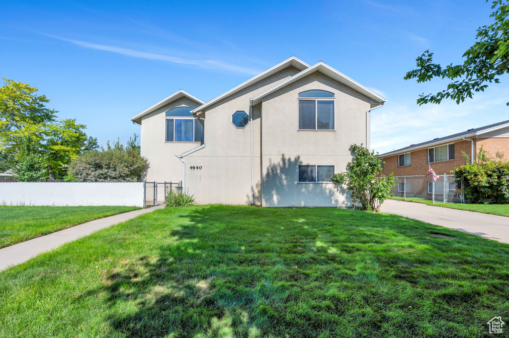 View of side of home with stucco siding
