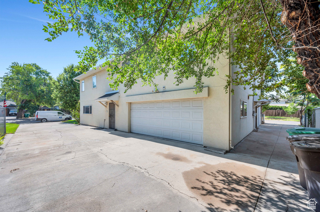 View of front of property featuring stucco siding and driveway