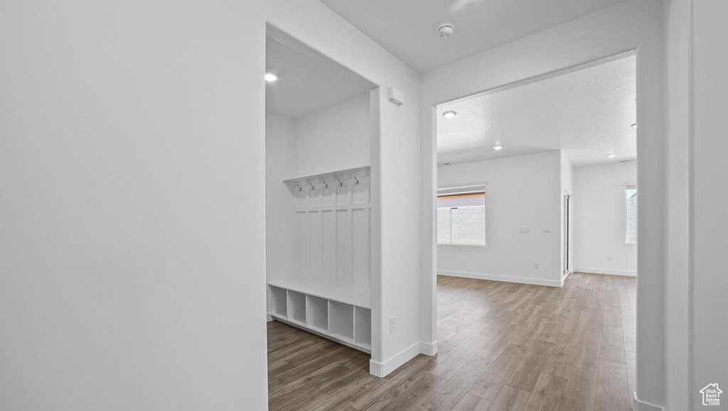 Mudroom featuring wood finished floors and recessed lighting