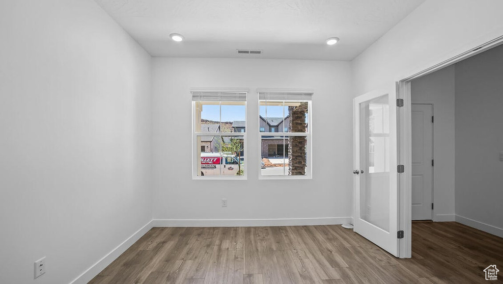 Unfurnished room with wood finished floors