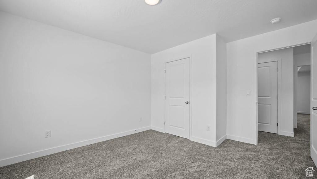 Unfurnished bedroom featuring carpet floors