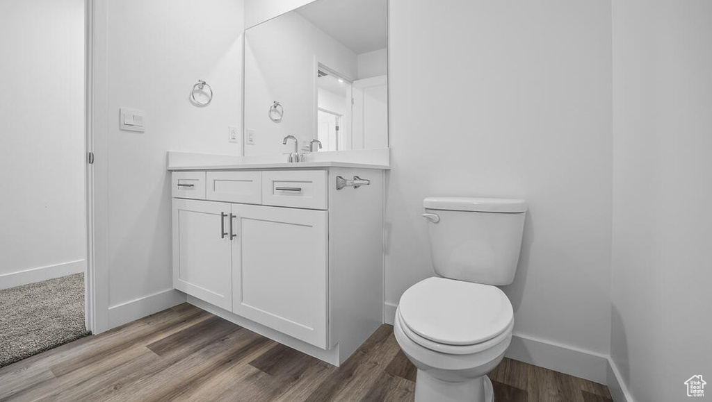Bathroom with vanity and wood finished floors