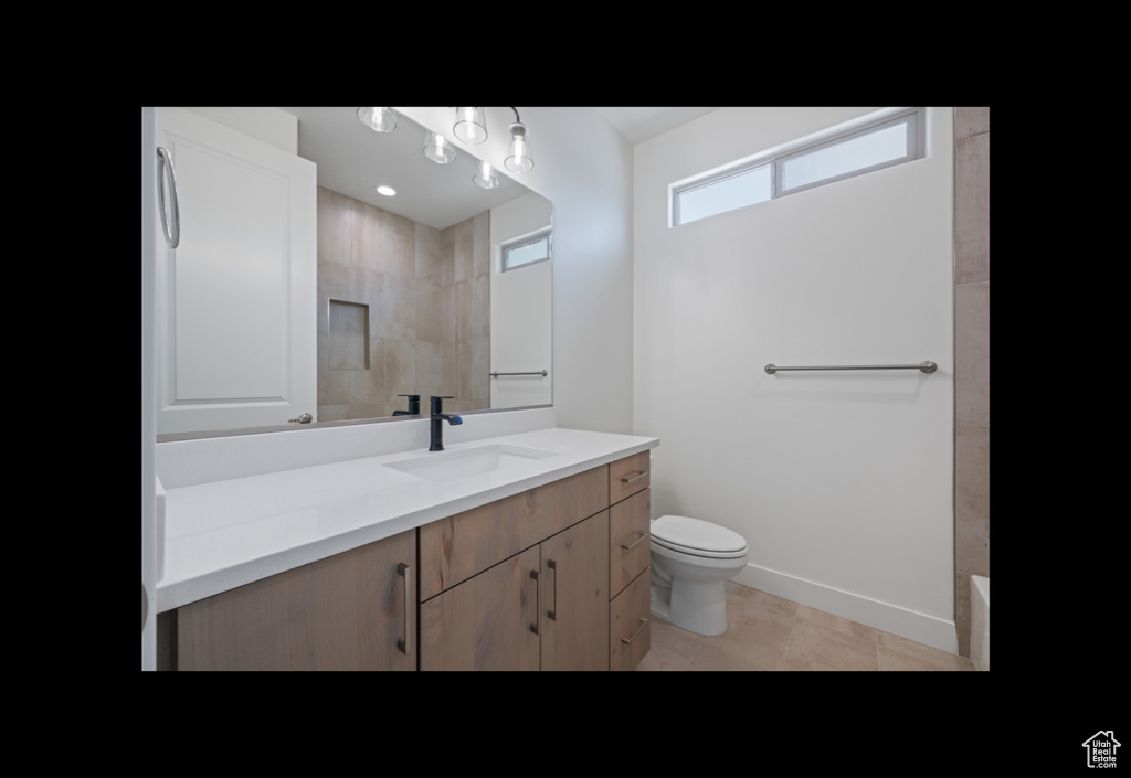 Bathroom featuring vanity and a shower