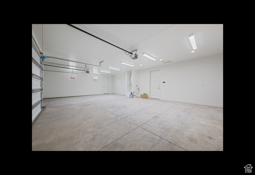 Garage featuring a garage door opener