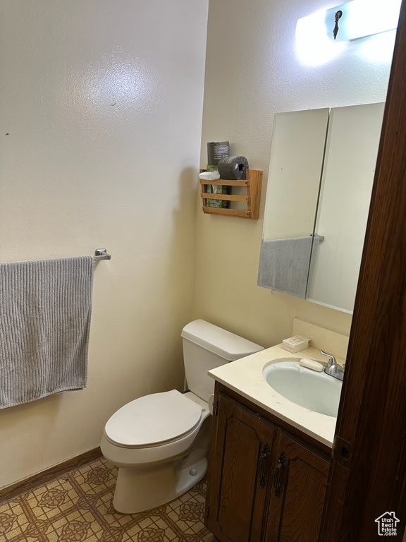 Bathroom with toilet and vanity