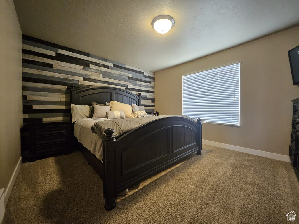Carpeted bedroom with baseboards