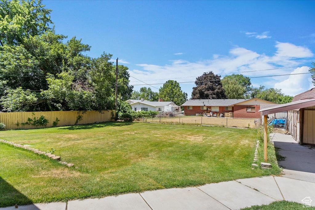 View of yard featuring a carport