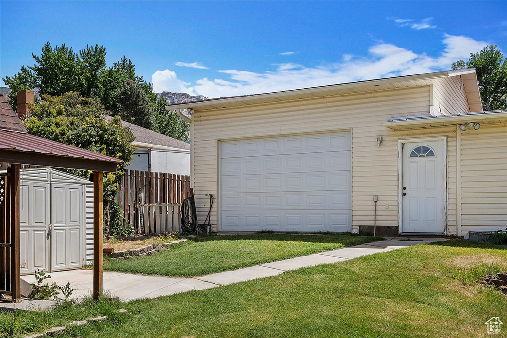 Garage featuring a storage unit