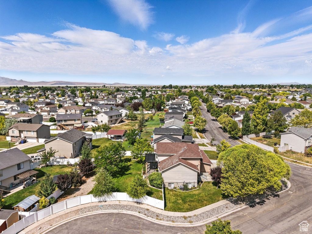 Aerial perspective of suburban area with a mountainous background