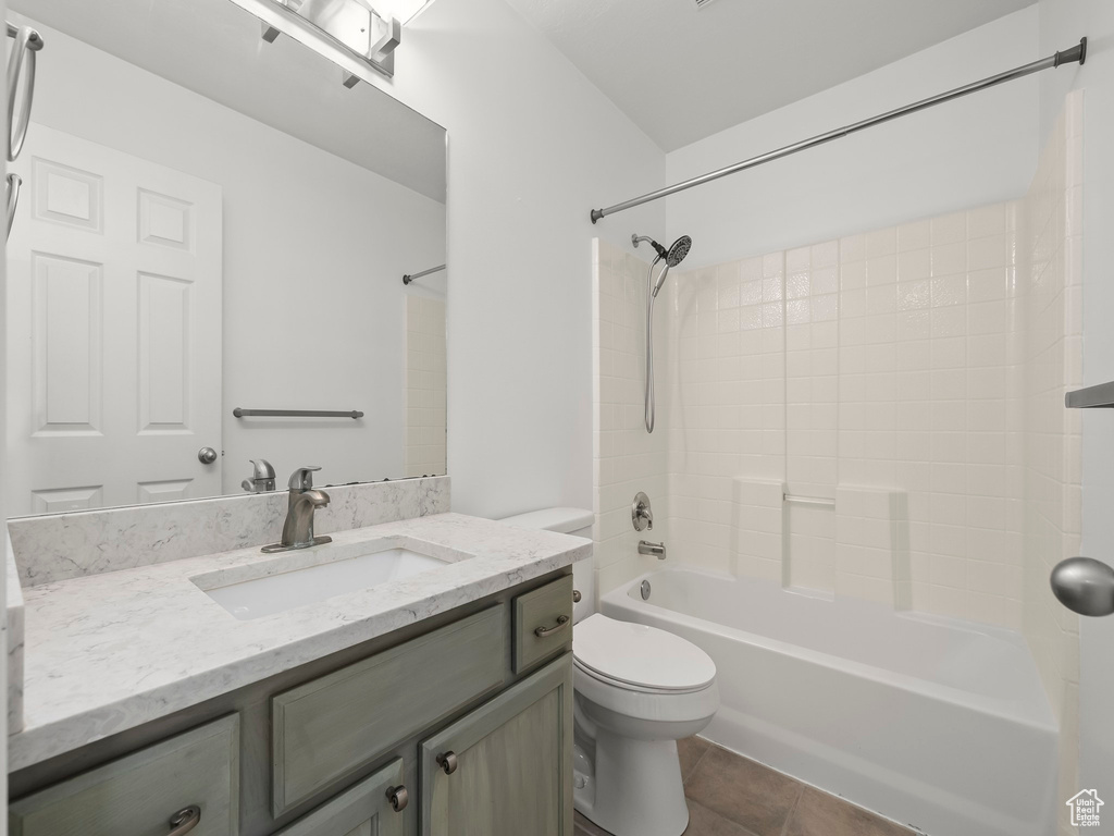 Bathroom with vanity,  shower combination, and tile patterned flooring