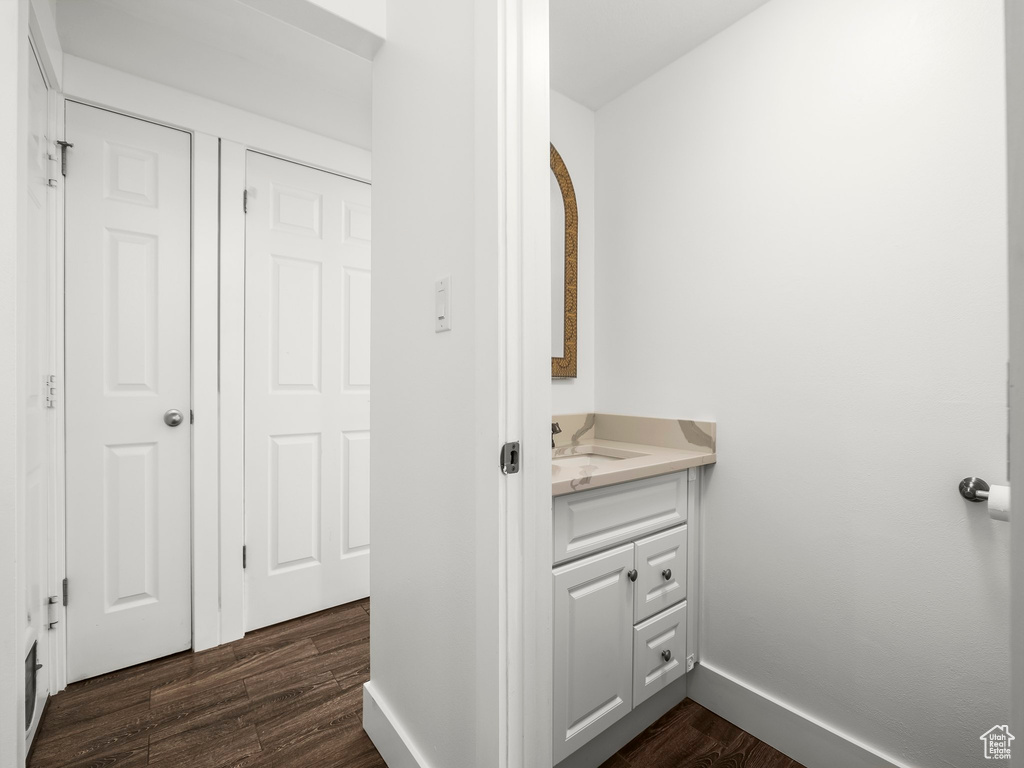 Bathroom with wood finished floors and vanity