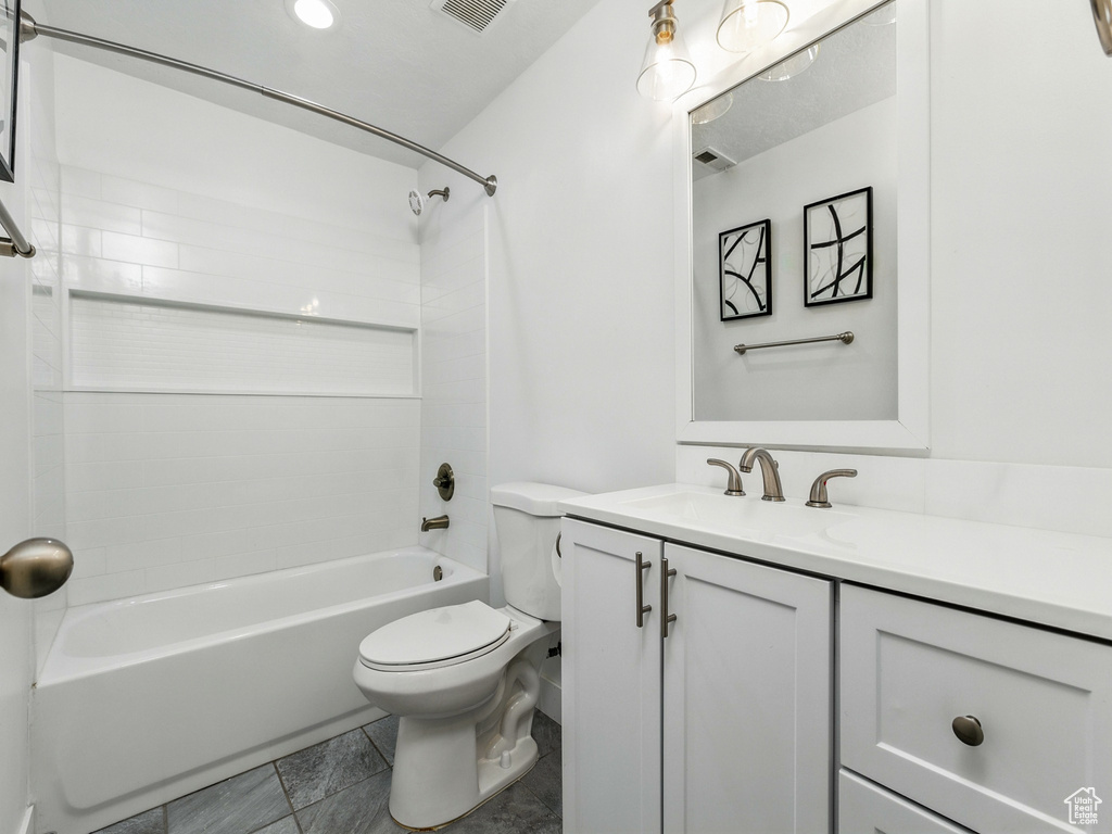Bathroom featuring vanity and bathtub / shower combination